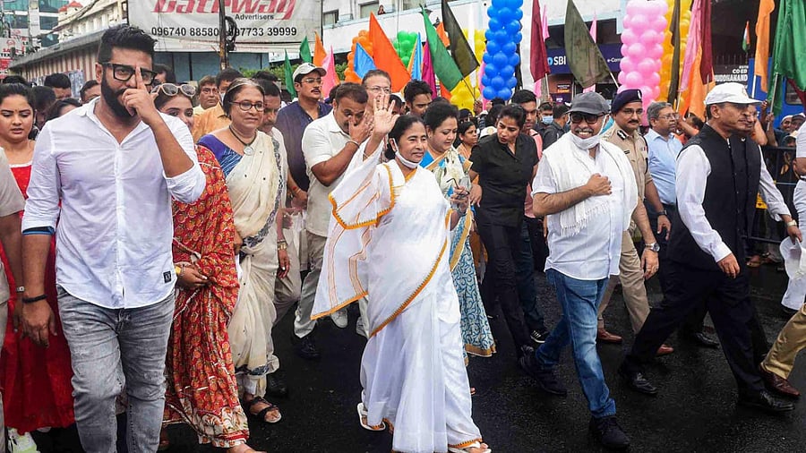 West Bengal Chief Minister Mamata Banerjee leads a procession to commemorate inscribing of 'Durga Puja in Kolkata' by UNESCO as the Intangible Cultural Heritage of Humanity, in Kolkata. Credit: PTI Photo