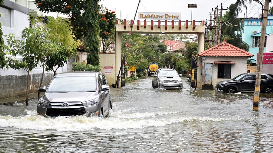 A waterlogged stretch at Rainbow Drive Layout on Sarjapur Road. Credit: DH Photo/B K Janardhan