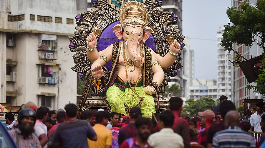 People are doing `pandal-hopping' with gusto, especially in central Mumbai areas of Lalbaug, Parel and Girgaon where some famous Ganesh Mandals or groups install the idols. Credit: PTI Photo
