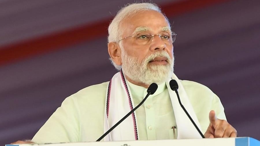 Prime Minister Narendra Modi addresses during the foundation laying ceremony of various projects, in Mangaluru. Credit: IANS Photo