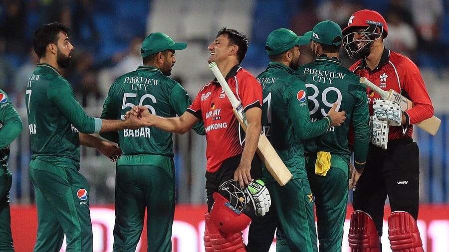  Hong Kong's Ehsan Khan and Mohammad Ghazanfar shake hand with Pakistani players during the T20 cricket match of Asia Cup between Pakistan and Hong Kong. Credit: IANS Photo