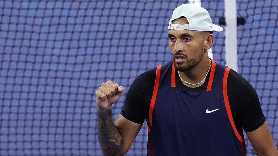 Nick Kyrgios of Australia celebrates after defeating J J Wolf, September 2, 2022. Credit: AFP Photo