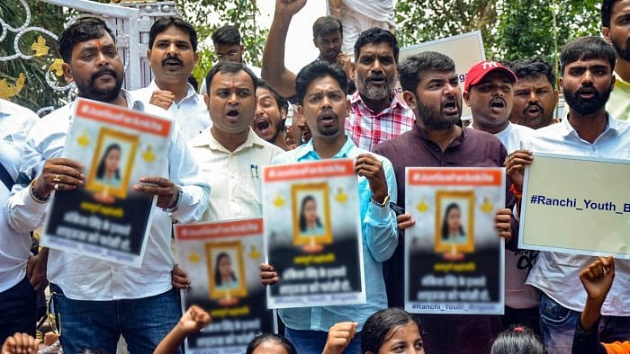 BJP workers protest outside the resort where Jharkhand UPA MLAs are staying, over the death of a class-12 student, who was allegedly set on fire by a man in Jharkhand's Dumka district. Credit: PTI Photo