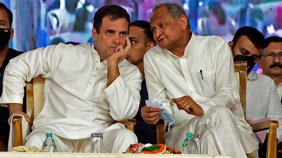 Congress party leader Rahul Gandhi (L) listens to the chief minister of Rajasthan state Ashok Gehlot during a rally at the Sabarmati River Front in Ahmedabad on September 5, 2022. Credit: AFP Photo