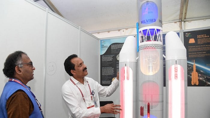 Dr Umamaheswaran R, Director, Human Space Flight Centre, Isro, and Dr S Somnath, chairman, Isro, look at a model of a space shuttle displayed at the Jawaharlal Nehru Planetarium in Bengaluru. Credit: DH Photo/B H Shivakumar
