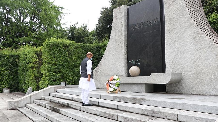 Rajnath Singh pays tributes to Japan's Self Defense Forces personnel. Credit: IANS Photo