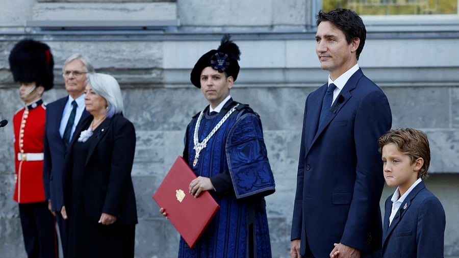 Canada's Prime Minister Justin Trudeau, with son Hadrien, Chief Herald of Canada Samy Khalid, and Canada's Governor General Mary Simon, with husband Whit Fraser, take part in a ceremony to proclaim the accession of King Charles III at Rideau Hall in Ottawa. Credit: Reuters Photo