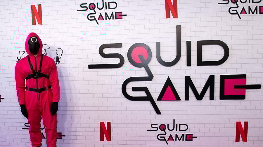 A pink soldier stands as part of the ambiance of Netflix's 'Squid Game' Los Angeles FYSEE Special Event, June 12, 2022. Credit: AFP File Photo