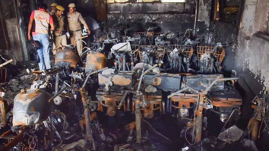  Hyderabad Police and members of their Clues team at the site after a fire broke out in an electric bike showroom on Monday, in Secundrabad, Tuesday, Sept. 13, 2022. Credit: PTI Photo