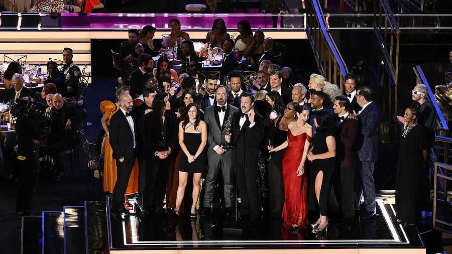US actor Jason Sudeikis (C) accepts the award for Outstanding Comedy Series for 'Ted Lasso' at the 74th Emmy Awards, September 12, 2022. Credit: AFP Photo