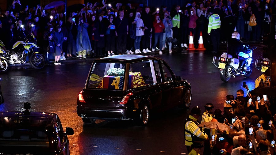 The crowd gather to watch the coffin of Queen Elizabeth II. Credit: AFP Photo