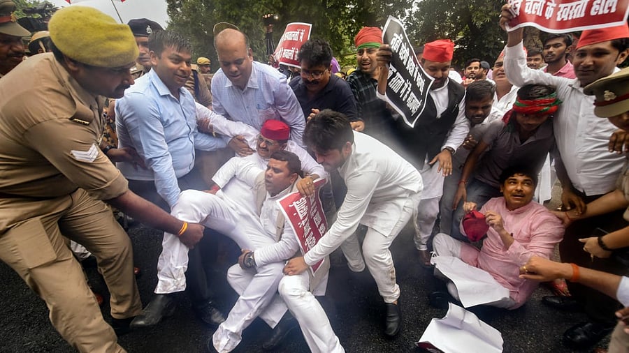Samajwadi Party (SP) MLAs stage a protest against BJP government outside party HQ, during the Monsoon session of Uttar Pradesh Assembly in Lucknow. Credit: PTI Photo