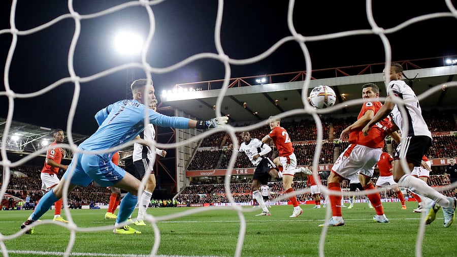 Fulham's Tosin Adarabioyo scores their first goal past Nottingham Forest's Dean Henderson. Credit: Reuters Photo