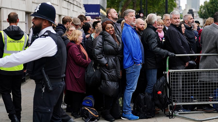 Crowds gather at Horse Guards Avenue ahead of the State Funeral of Queen Elizabeth II. Credit: Reuters Photo
