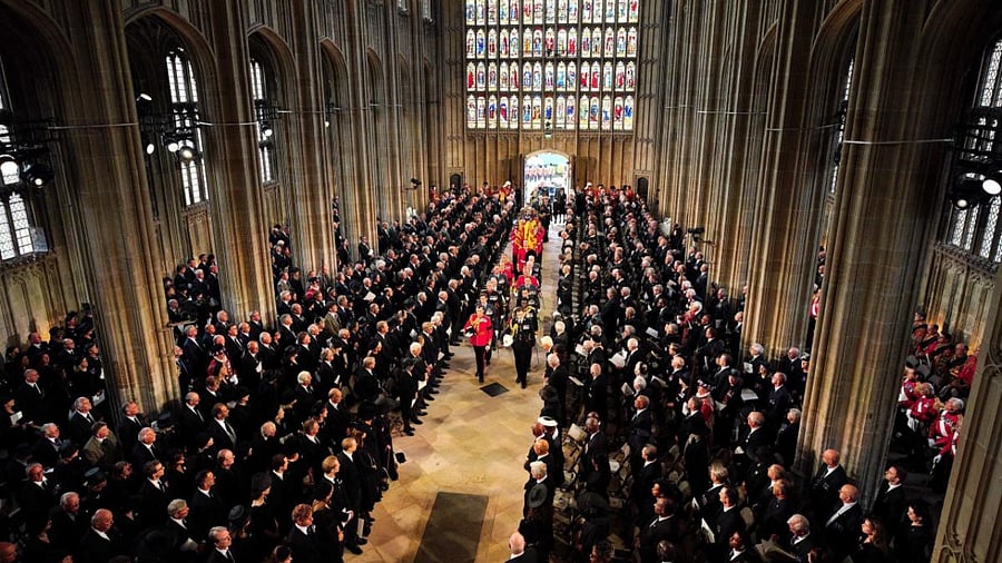 Pall bearers carry the coffin of Queen Elizabeth II with the Imperial State Crown resting on top into St. George's Chapel during the Committal Service for Britain's Queen Elizabeth II, at Windsor Castle. Credit: AFP Photo