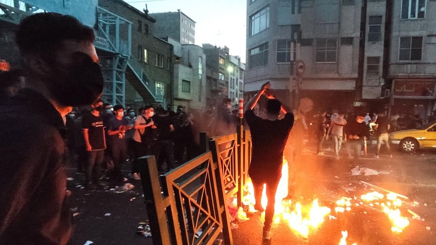 The picture shows Iranian demonstrators taking to the streets of the capital Tehran during a protest for Mahsa Amini, days after she died in police custody. Credit: AFP Photo