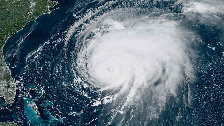Climate change can also boost the amount of rainfall delivered by a storm. Because a warmer atmosphere can also hold more moisture, water vapor builds up until clouds break, sending down heavy rain. Credit: AFP Photo