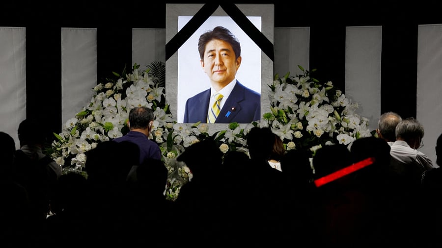 People lay flowers and pay their respects outside Nippon Budokan Hall where the state funeral for former Prime Minister Shinzo Abe was held, in Tokyo, Japan September 27, 2022. Credit: Reuters Photo