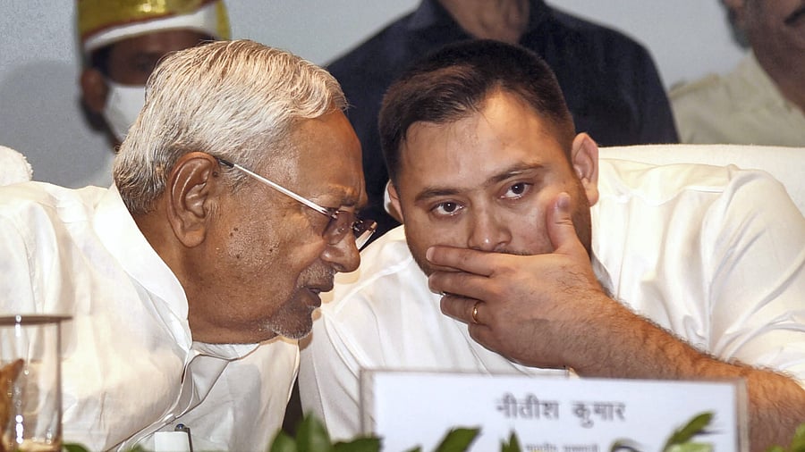 Bihar Chief Minister Nitish Kumar interacts with Deputy Chief Minister Tejashwi Yadav. Credit: PTI File Photo