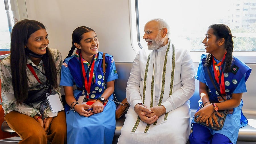 Prime Minister Narendra Modi rides a metro after inaugurating the phase-1 of Ahmedabad Metro rail project between Thaltej and Vastral, in Ahmedabad. Credit: PTI Photo