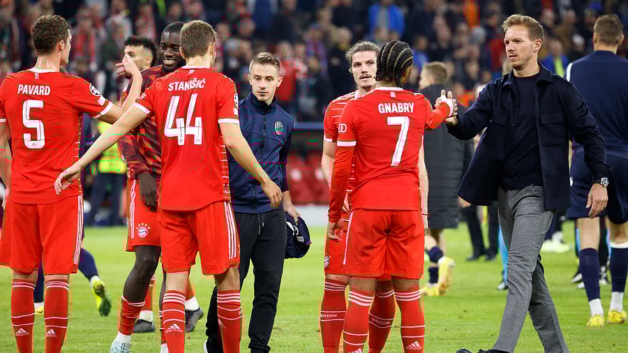 Bayern Munich coach Julian Nagelsmann celebrates with Serge Gnabry and teammates after the match. Credit: Reuters Photo