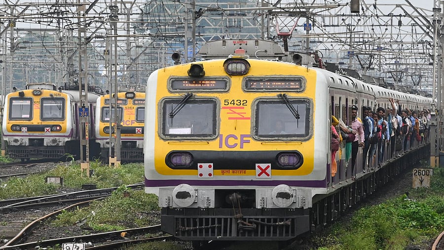 As trains came to a halt, commuters got down at many places and were seen walking on the tracks towards the next station. Credit: AFP Photo