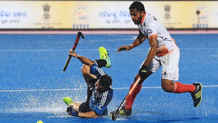 Harmanpreet Singh (R). Credit: AFP Photo