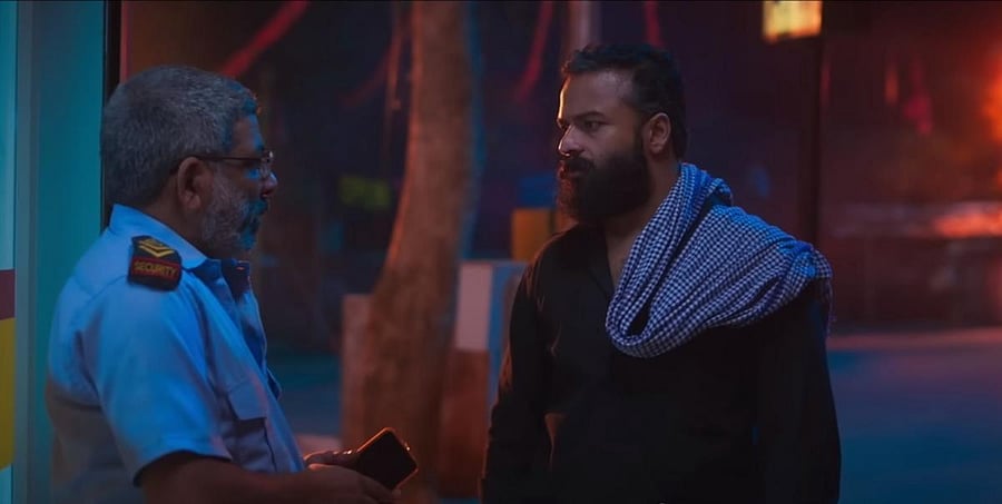 Jaffar Idukki and Jayasurya in 'Eesho'.