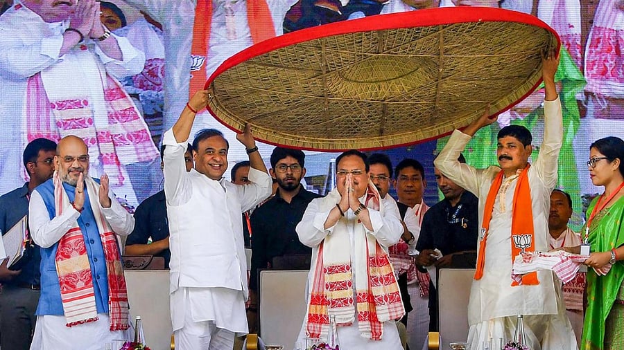 Union Home Minister Amit Shah with BJP National President JP Nadda and Assam CM Himanta Biswa Sarma and others during a public meeting at Khanapara ground in Guwahati. Credit: PTI Photo