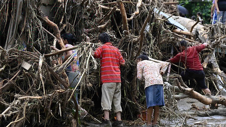 Residents dug through the remains of battered homes looking for loved ones, while search teams arrived with dogs hoping to find survivors trapped in the rubble. Credit: AFP Photo