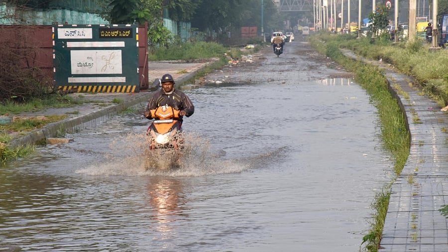 Water logged on on Outer Ring Road near Veeranapalya following downpour in Bengaluru on Friday. Credit: DH Photo/BK Janardhan
