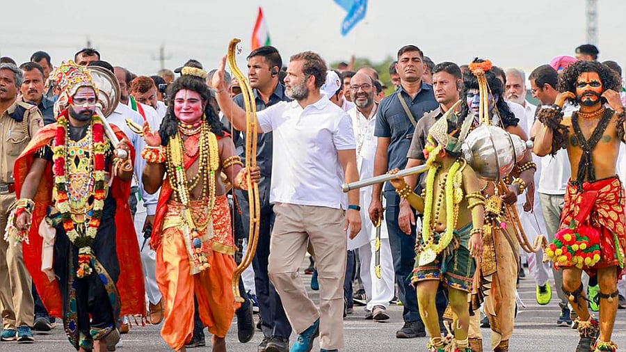 Rahul Gandhi walks with artists dressed as Hindu deities during Congress' 'Bharat Jodo Yatra' in Karnataka's Chitradurga district. credit: PTI Photo