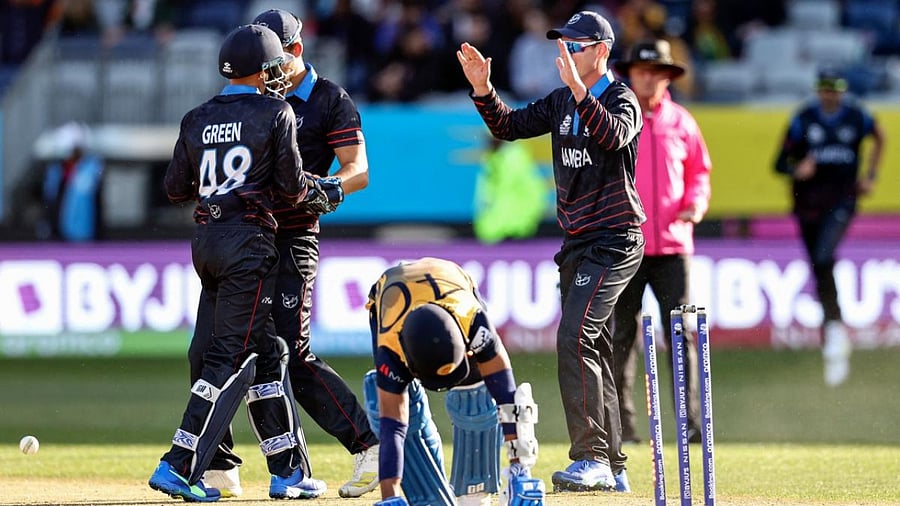 Sri Lanka's Pramod Madushan (C) is run out during the Australia 2022 Twenty20 World Cup cricket tournament match between Sri Lanka and Namibia. Credit: AFP Photo