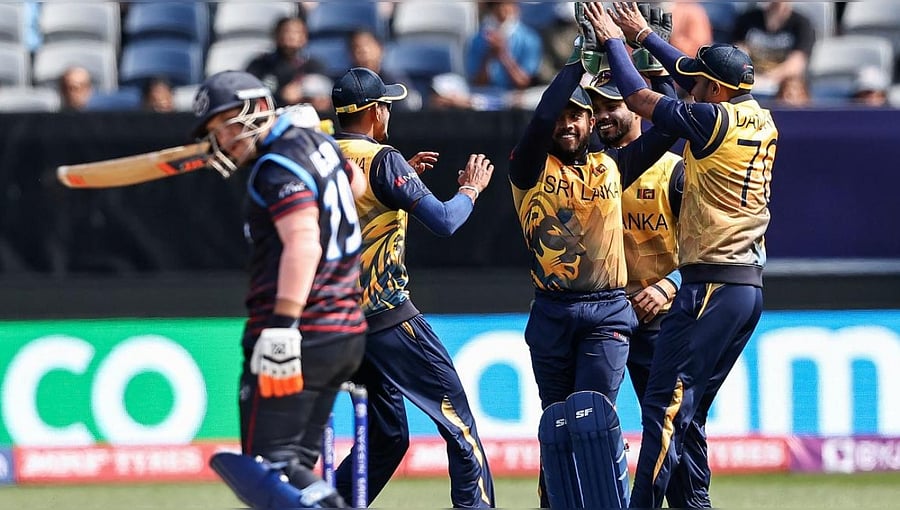 SL's Kusal Mendis (C) celebrates a catch to dismiss Namibia's Jan Nicol Loftie-Eaton at Kardinia Park in Geelong, Australia. Credit:  AFP Photo