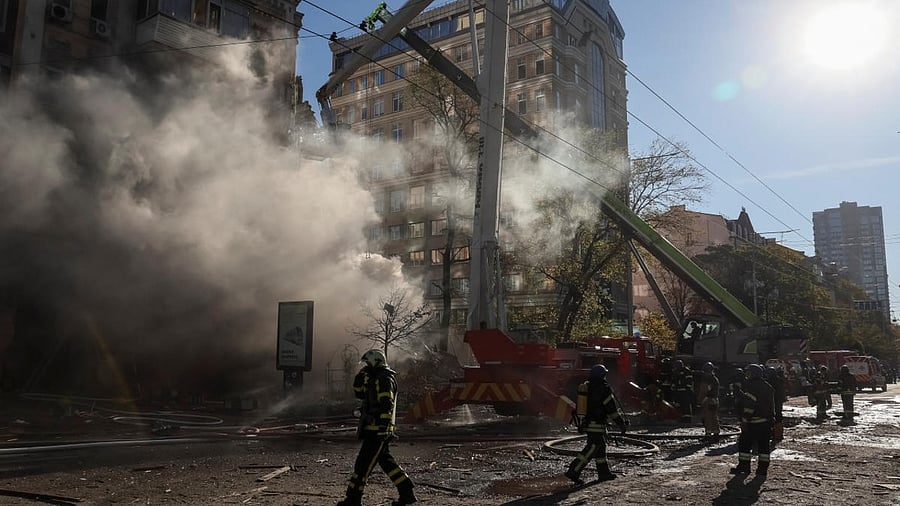 Firefighters work to put out a fire in a residential building destroyed by a Russian drones strike in Kyiv. Credit: Reuters Photo