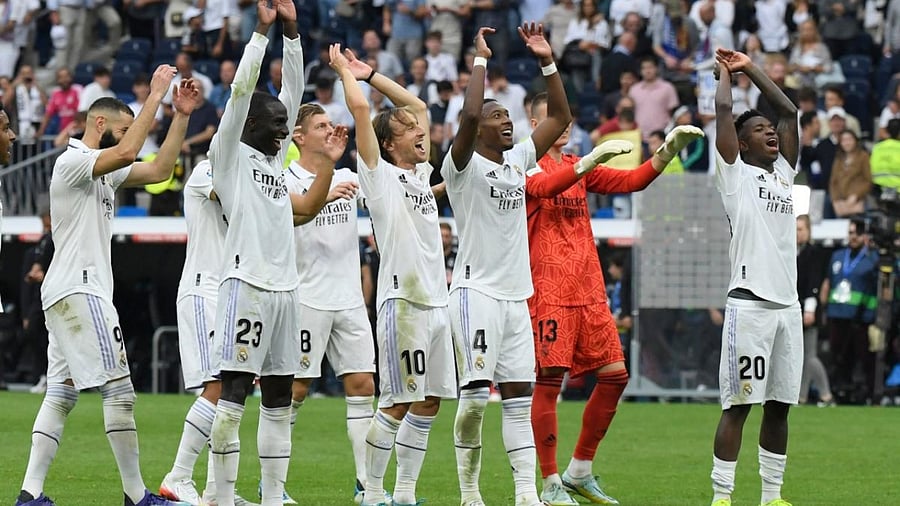 Real Madrid's players celebrate victory after the Spanish League football match between Real Madrid CF and FC Barcelona at the Santiago Bernabeu stadium in Madrid. Credit: AFP Photo