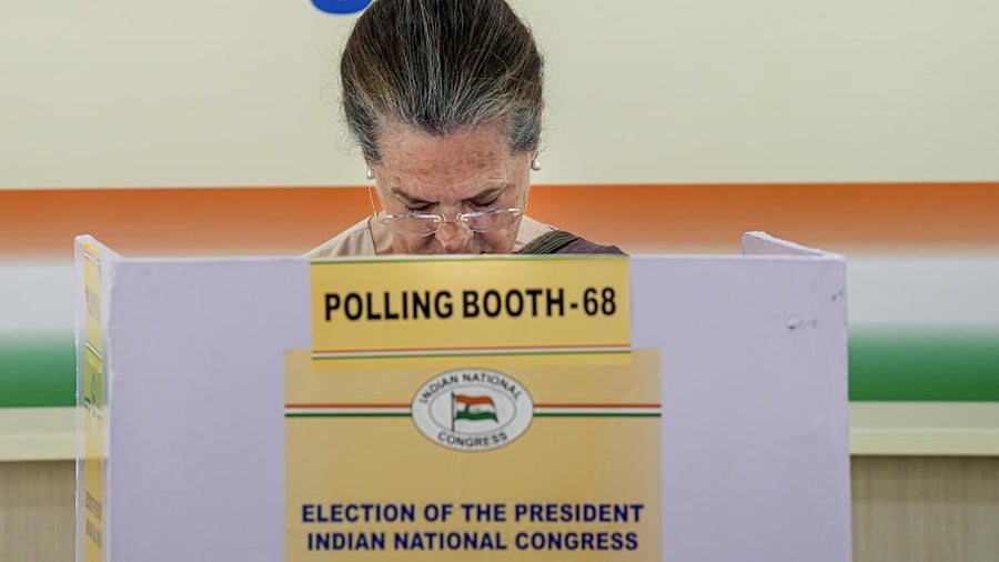 Congress interim President Sonia Gandhi casts her vote for the party's Presidential election at AICC headquarters, in New Delhi. Credit: PTI Photo