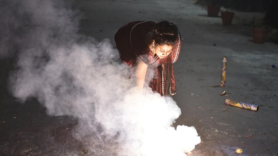 People burst fire crackers during Diwali celebrations in Ghaziabad. Credit: PTI File Photo