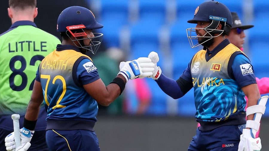 Sri Lanka's Kusal Mendis and Charith Asalanka (L) bump gloves during the T20 World Cup match between Sri Lanka and Ireland. Credit: PTI Photo