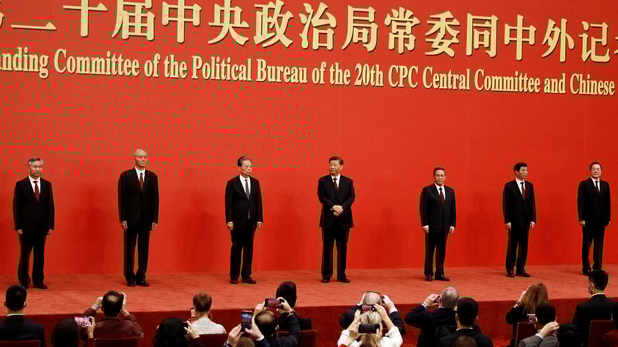 Xi Jinping with the new members of the Politburo Standing Committee. Credit: Reuters Photo