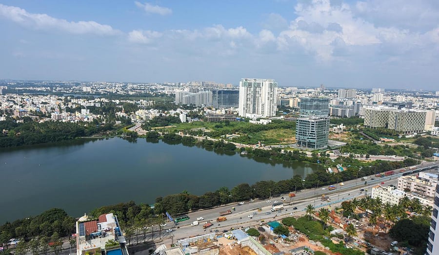 Nagawara lake is full of water today, and it triggers the fear of floods among residents, with every rain. Credit: DH Photo