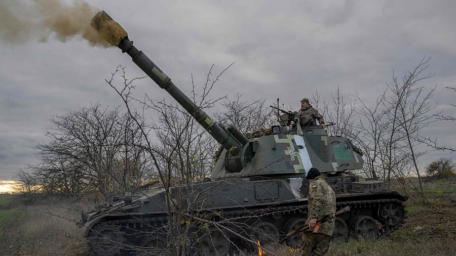 Ukrainian artillery unit members fire towards Kherson on October 28, 2022, outside of Kherson region, amid Russia's military invasion on Ukraine.. Credit: AFP Photo