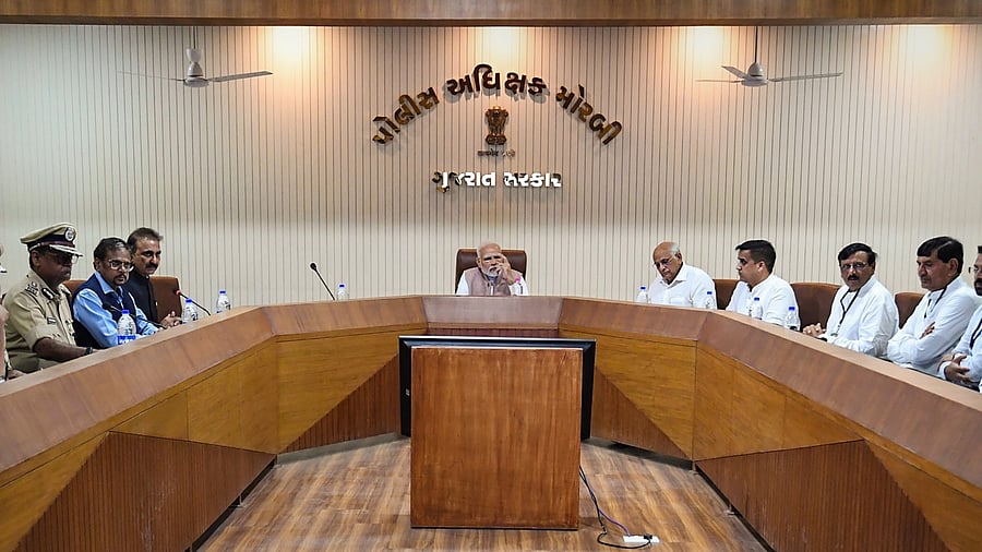 Prime Minister Narendra Modi chairs a review meeting on the suspension bridge collapse incident, in Morbi district, Tuesday, Nov. 1, 2022. Credit: PTI Photo
