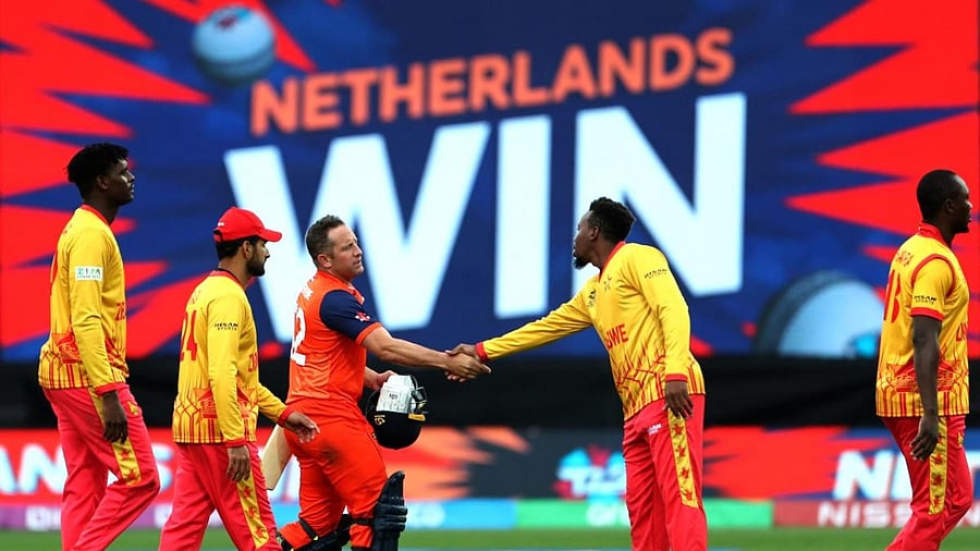 Netherlands' Roelof van der Merwe (C) shakes hands with Zimbabwe player after a win during the ICC men's Twenty20 World Cup 2022 cricket match between Netherlands and Zimbabwe at Adelaide Oval on November 2, 2022 in Adelaide. Credit: AFP Photo