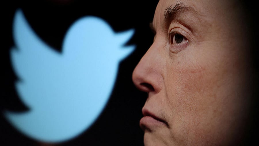 Twitter logo and a photo of Elon Musk are displayed through magnifier in this illustration. Credit: Reuters Photo