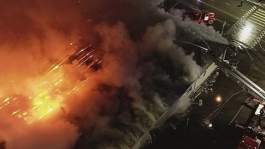 In this handout photo released by Russian Emergency Ministry Press Service, firefighters extinguish a fire of a cafe in Kostroma, Russia, Saturday, Nov. 5, 2022. Credit: AP/PTI