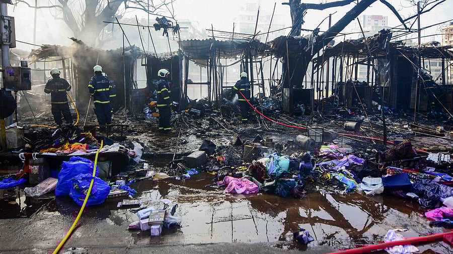 Firefighters douse a fire at Fashion Street in Mumbai. Credit: PTI Photo
