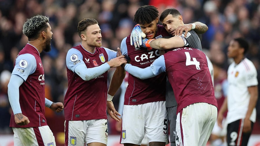 Aston Villa's Douglas Luiz, Matty Cash, Ezri Konsa, Tyrone Mings and Emiliano Martinez celebrate after the match. Credit: Reuters Photo