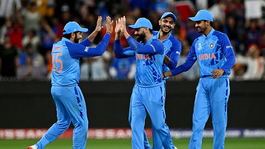Kohli celebrates taking the catch to dismiss Zimbabwe's Wessly Madhevere Joel. Credit: Reuters Photo