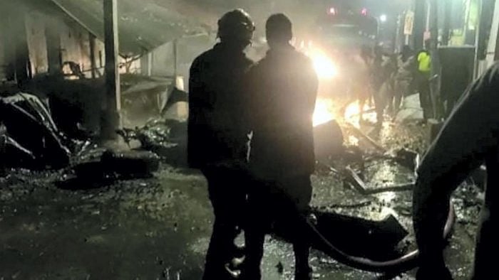 Emergency services personnel at the site after an LPG cylinder exploded inside a car in Coimbatore. Credit: PTI Photo